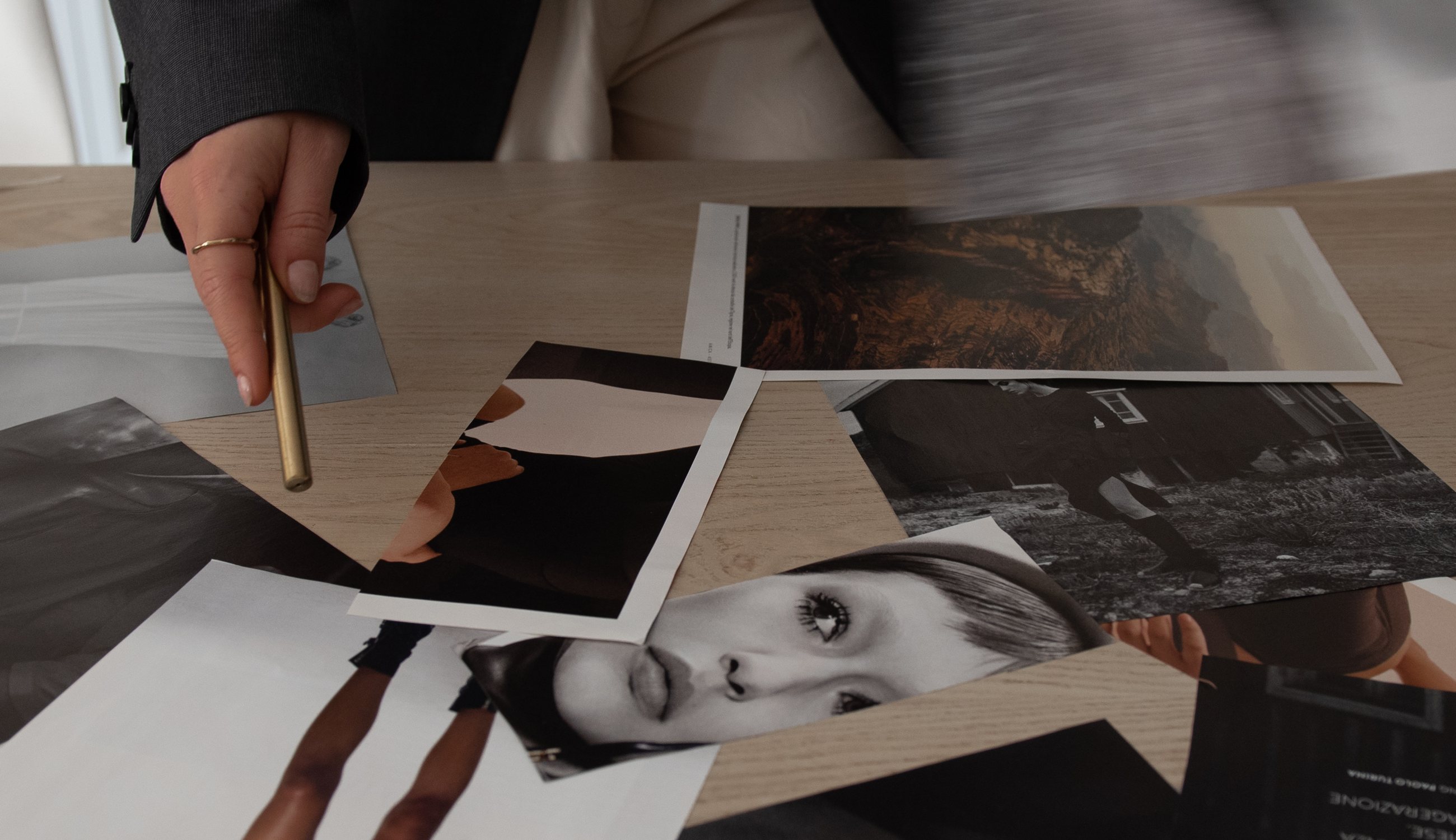 Printed layouts spread across a table while a campaign is planned